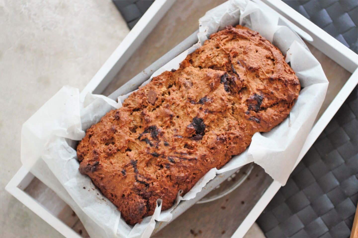 chocolate chip pumpkin loaf in loaf tin, shot from above