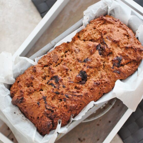 chocolate chip pumpkin loaf in loaf tin, shot from above