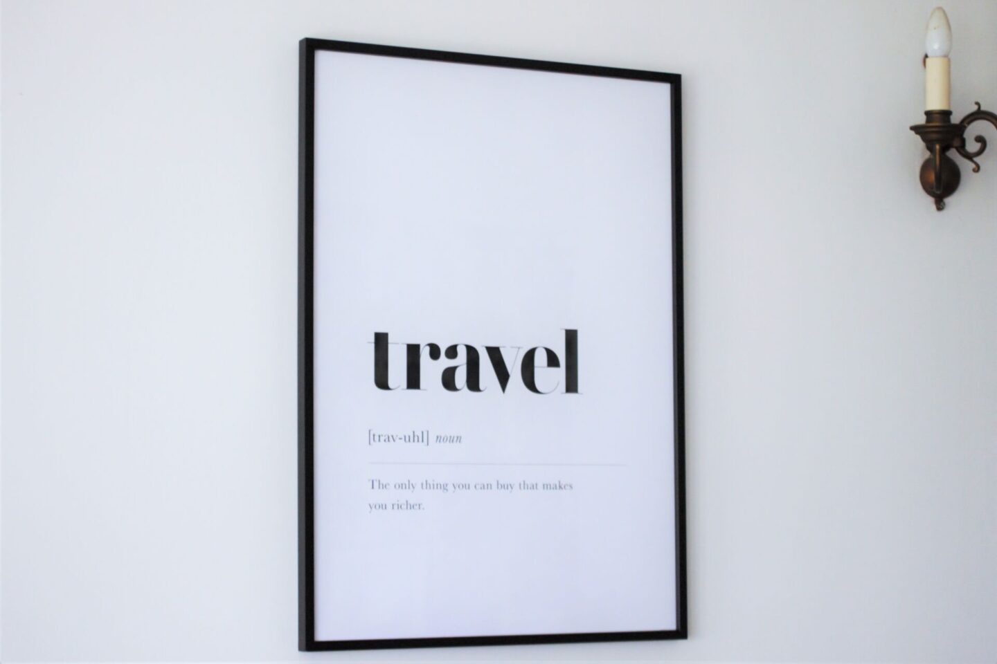 large simple black & white print on a white wall