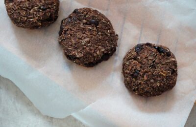 three cranberry & quinoa Christmas bakes on a baking tray
