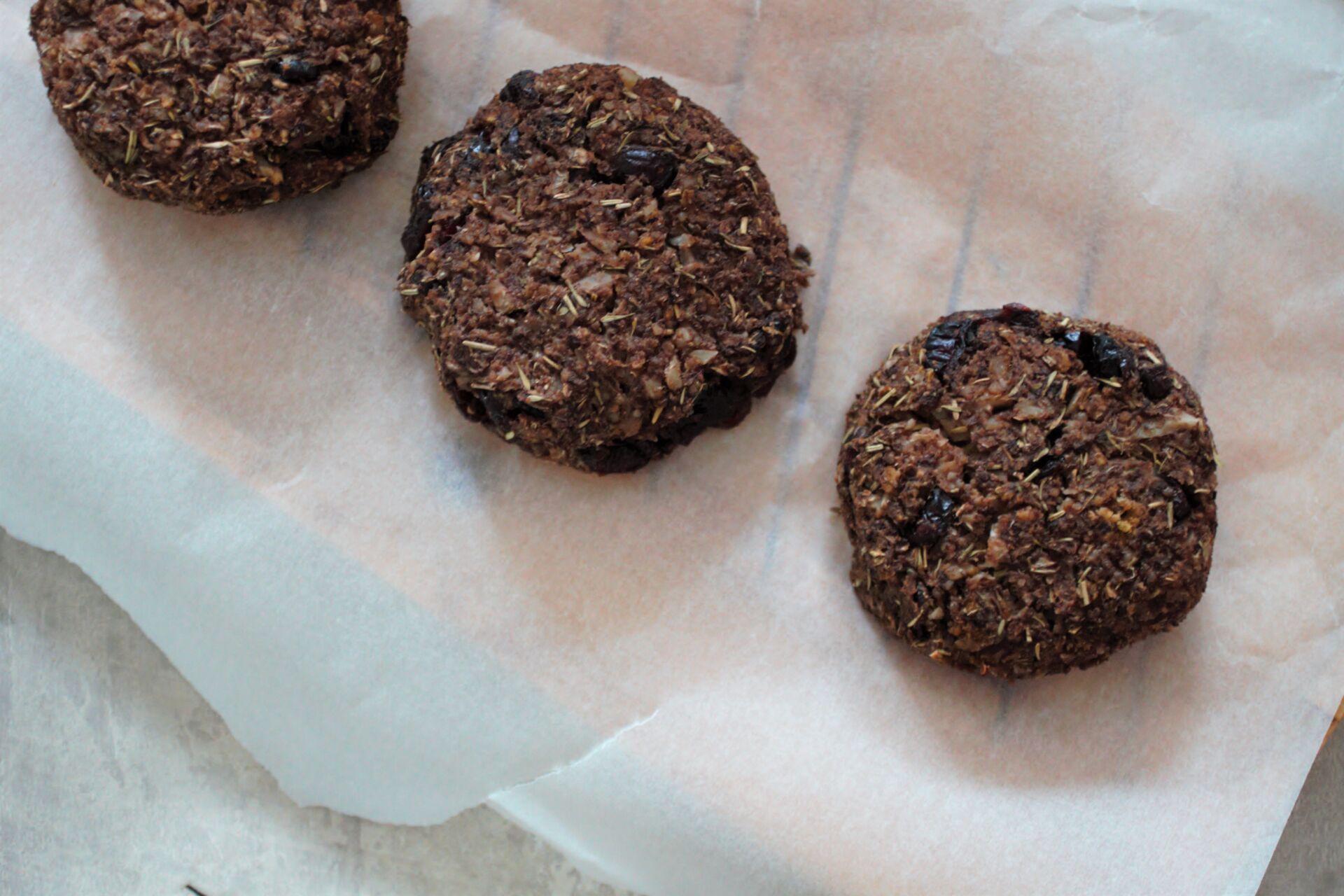 three cranberry & quinoa Christmas bakes on a baking tray