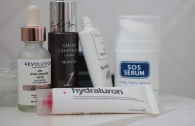 a selection of cruelty free hydrating skincare placed on a white sheet