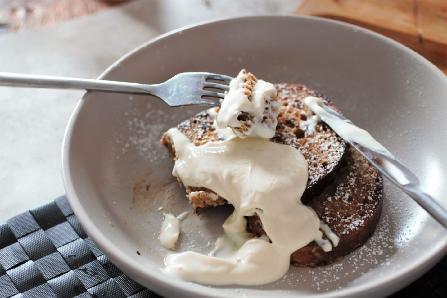 vegan french toast recipe with toppings in a grey bowl