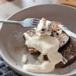 vegan french toast recipe with toppings in a grey bowl