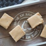 peppermint white chocolate cheesecake slices on a grey wooden board