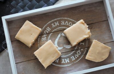 peppermint white chocolate cheesecake slices on a grey wooden board