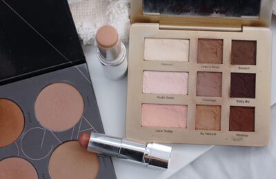 a pile of makeup products