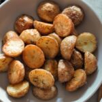 large bowl of vegan roast potatoes