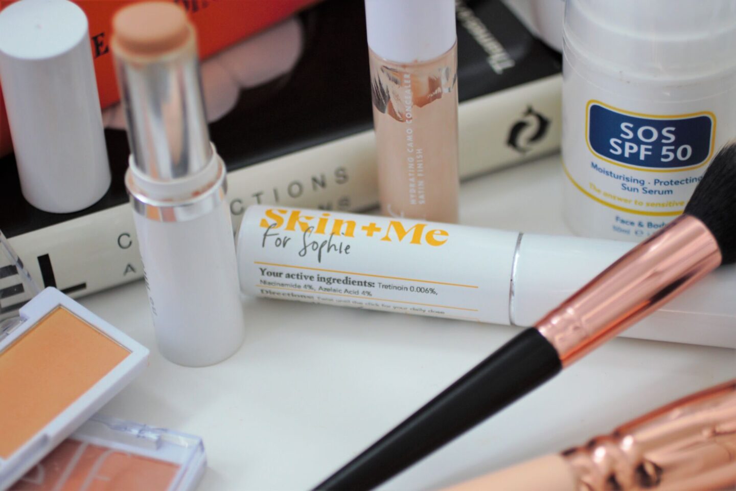 a skin & me moisturiser surrounded by other best beauty products 2021