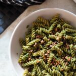 bowl of festive pesto recipe on green pea pasta