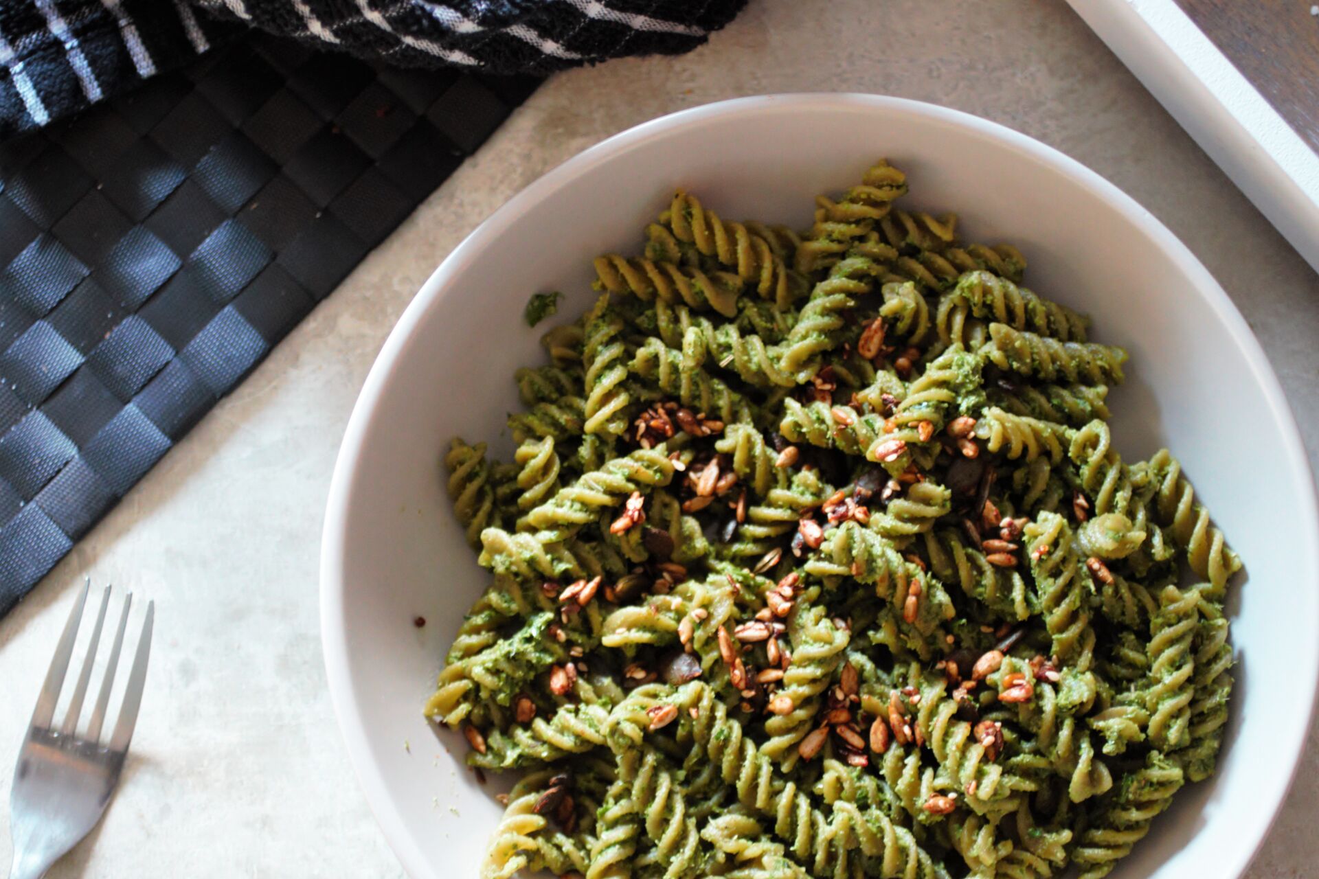 bowl of festive pesto recipe on green pea pasta