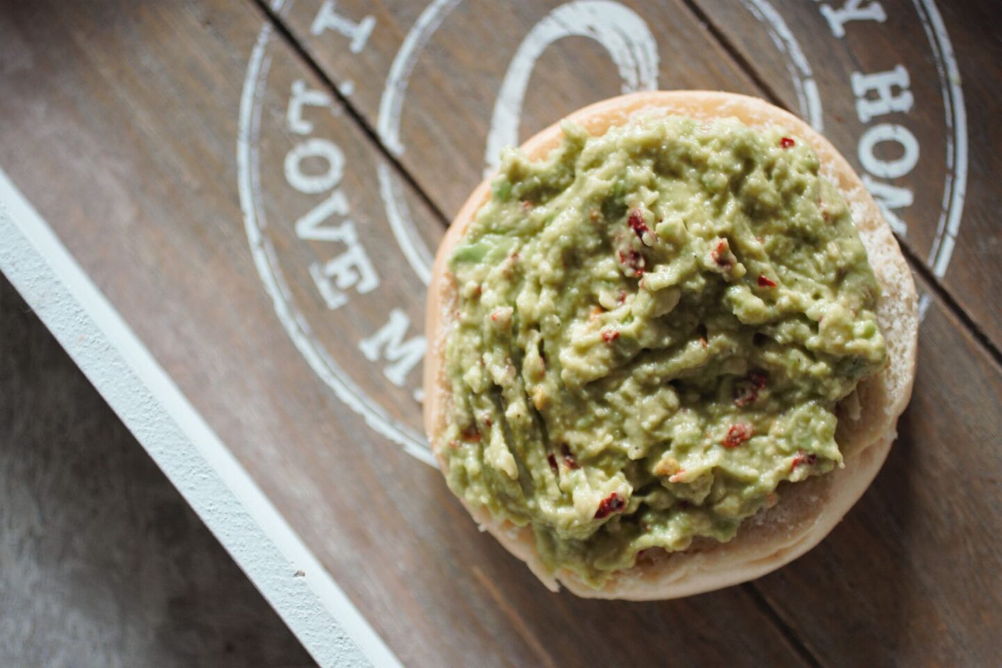 burger bun topped with lazy guacamole