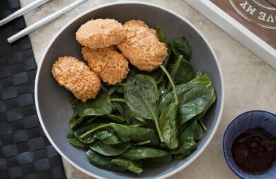 bowl of carrot nuggets and a salad
