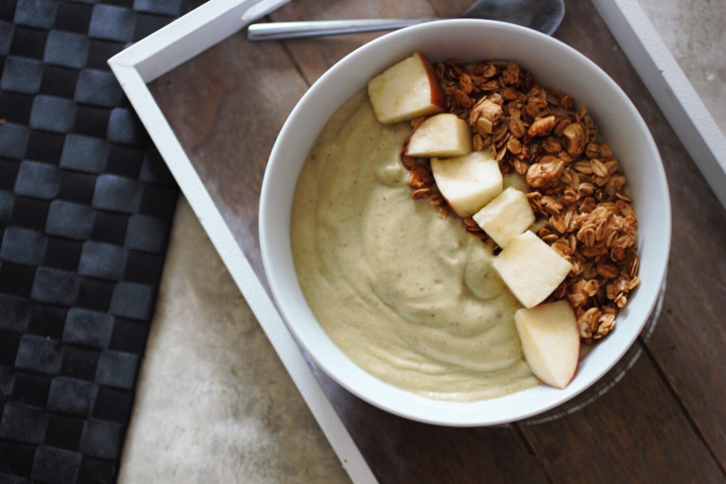 apple pie smoothie bowl recipe, shot from above, topped with apple chunks and granola