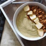 apple pie smoothie bowl recipe, shot from above, topped with apple chunks and granola