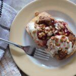 baked breakfast ciabatta topped with yoghurt and nut butter, shot from above