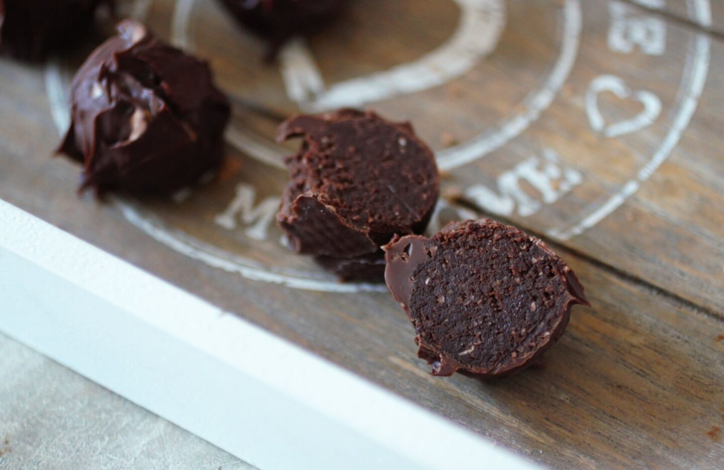 a chocolate truffle sliced open to show the centre