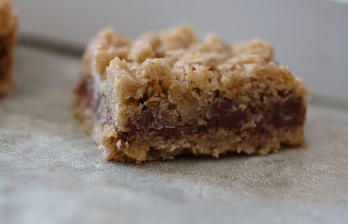 a close up shot of one oat bar, showing the texture inside