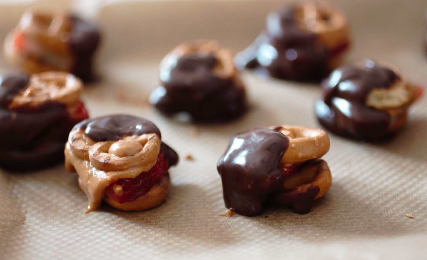 a close up shot of a tray of chocolate pretzel bites
