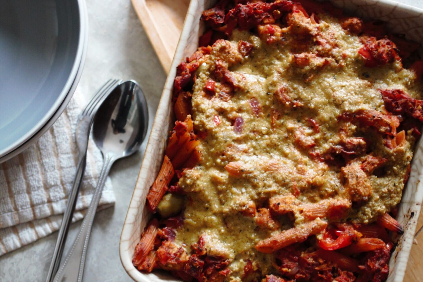 freshly baked sundried tomato pasta bake recipe, on a table, ready to be served