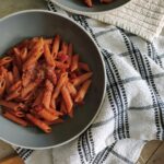 two bowls of red wine pasta