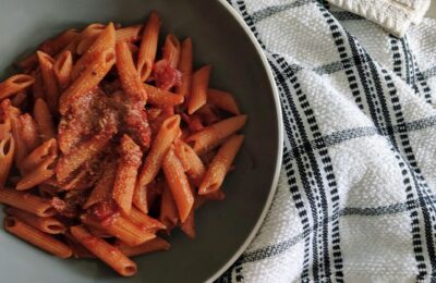 two bowls of red wine pasta