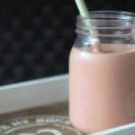 summer smoothie recipe in a kilner jar with a metal straw in