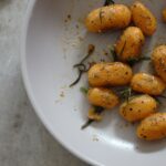 bowl of pumpkin gnocchi recipe with rosemary and sage