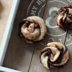 Vegan Orange Nutella Pastry Swirls on a grey wooden tray