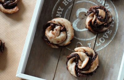 Vegan Orange Nutella Pastry Swirls on a grey wooden tray