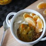 passionfruit curd recipe in a bowl with some greek yoghurt, granola and fruit