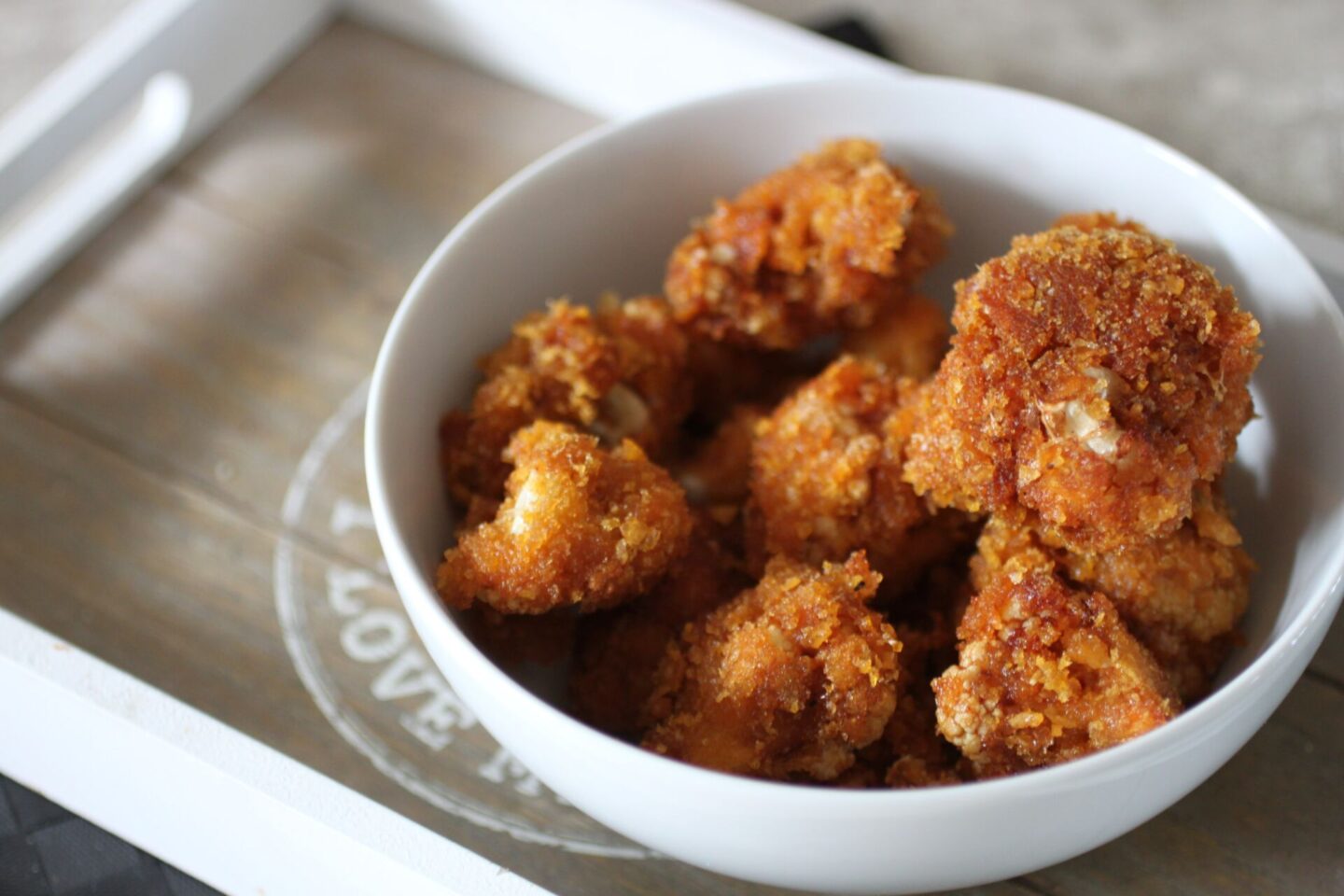white bowl filled with fried barbecue cauliflower