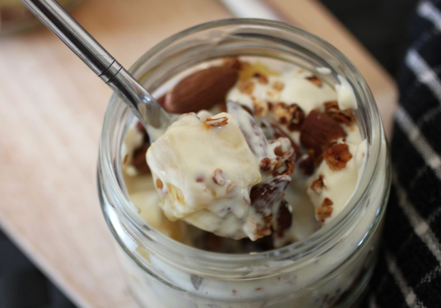a spoon of pineapple crunch pot showing all of the components 
