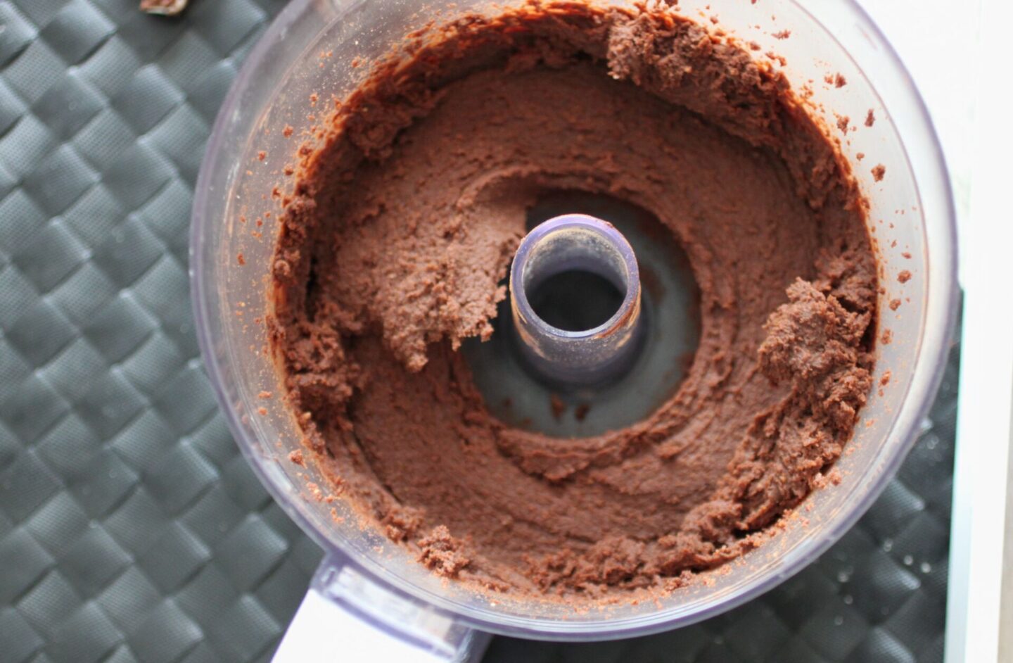 food processor filled with freshly made chocolate hummus