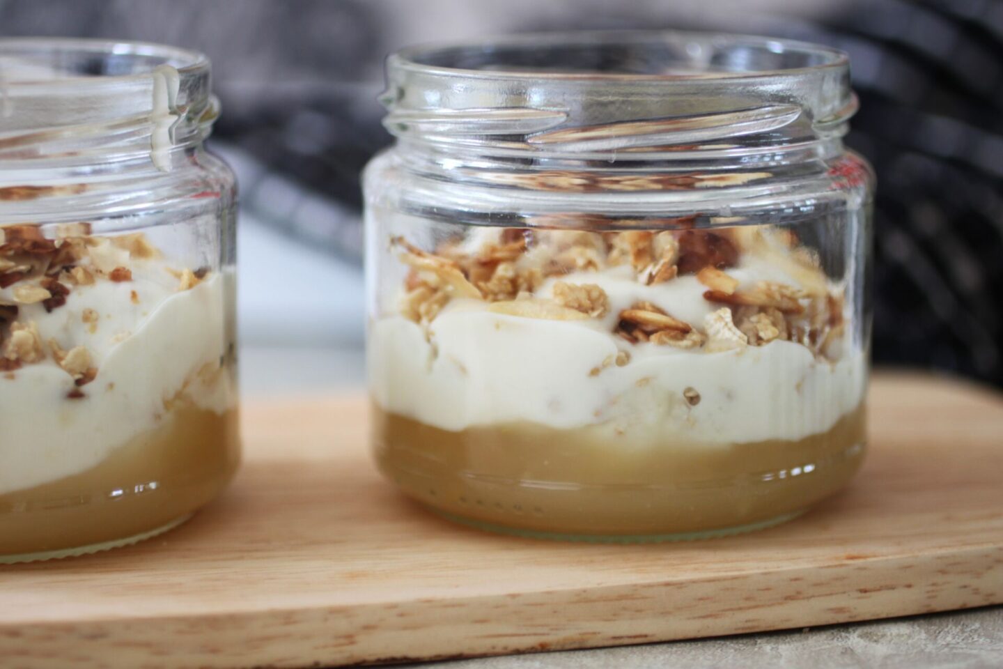 two lemon breakfast pots placed on a wooden tray