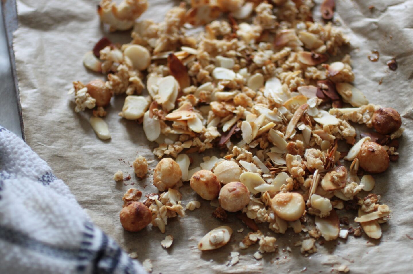 baking tray with the oat and nut mixture on it, freshly baked