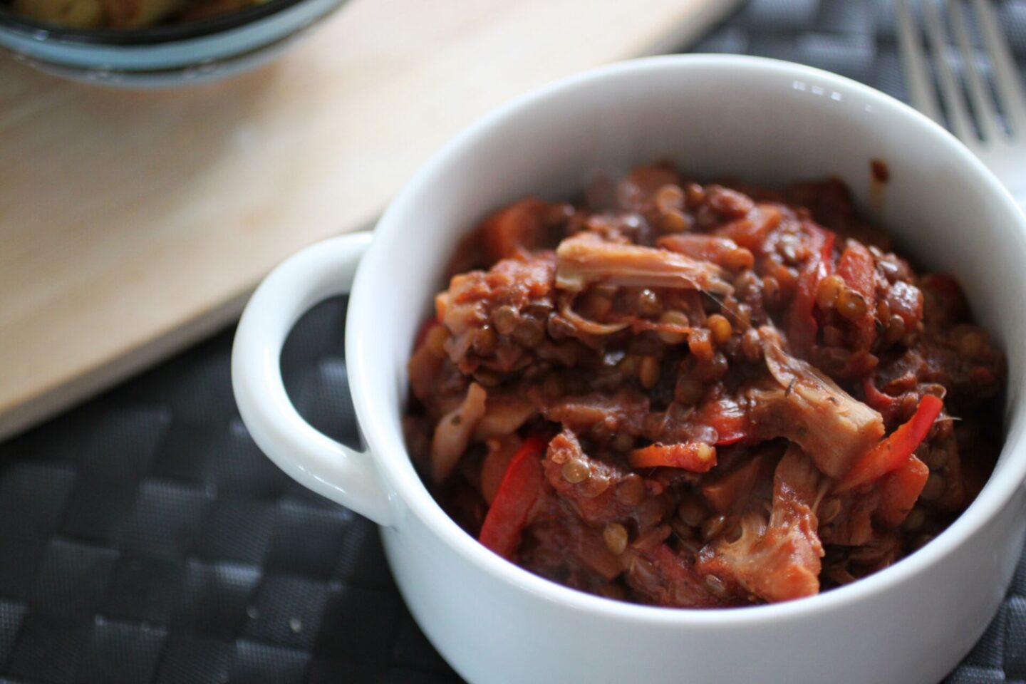 a white bowl filled with jackfruit casserole