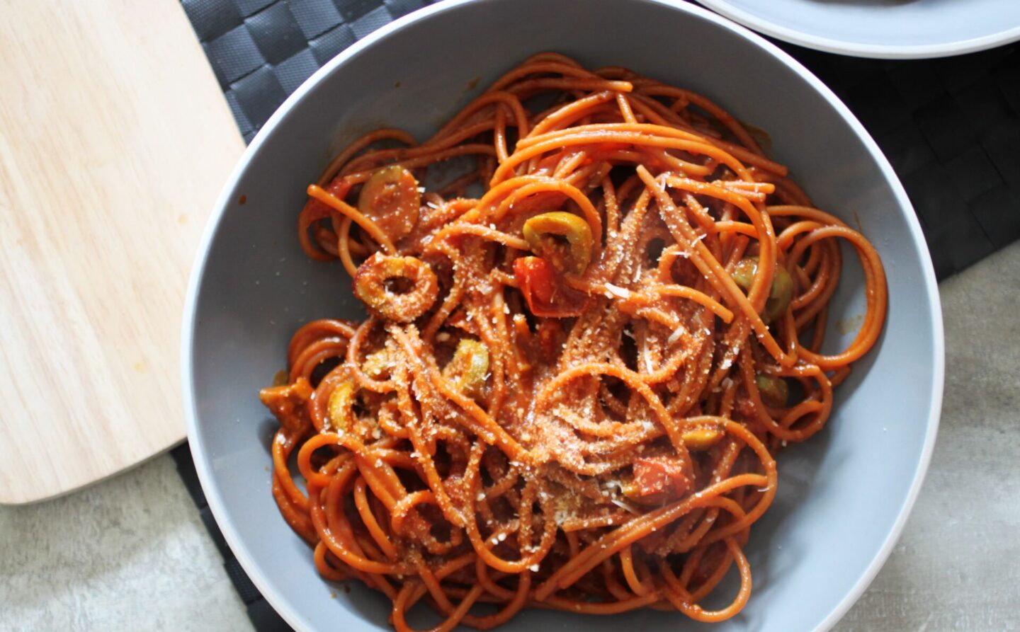 one bowl of vegan nduja pasta recipe on a table, shot from above