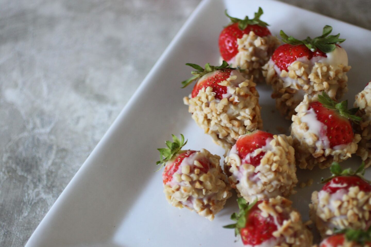plate of white chocolate covered strawberries