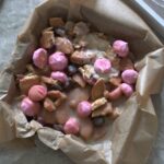 baking tin filled with batch of strawberry crunch bars, not sliced