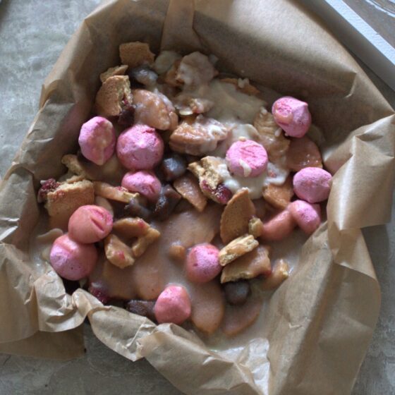 baking tin filled with batch of strawberry crunch bars, not sliced