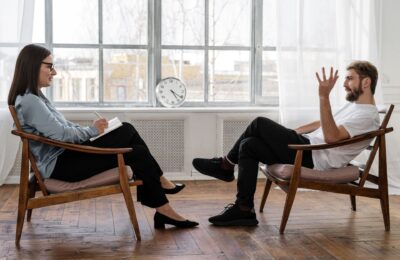 a man and a woman in a therapy setting