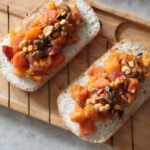 caramelised squash toast on a wooden board, shot from above