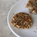 some crispy celeriac hash , baked and fried, on a white plate