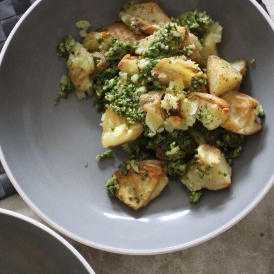 kale pesto smashed potatoes in a large bowl