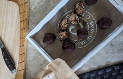 mint chocolate cheesecake balls on a wooden board