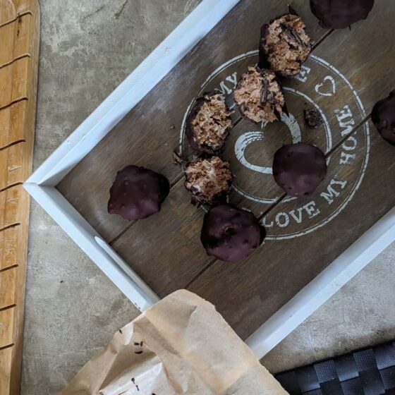 mint chocolate cheesecake balls on a wooden board