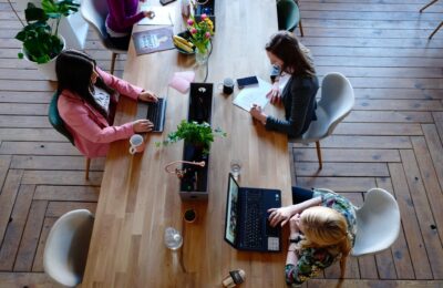 a long table with several people working