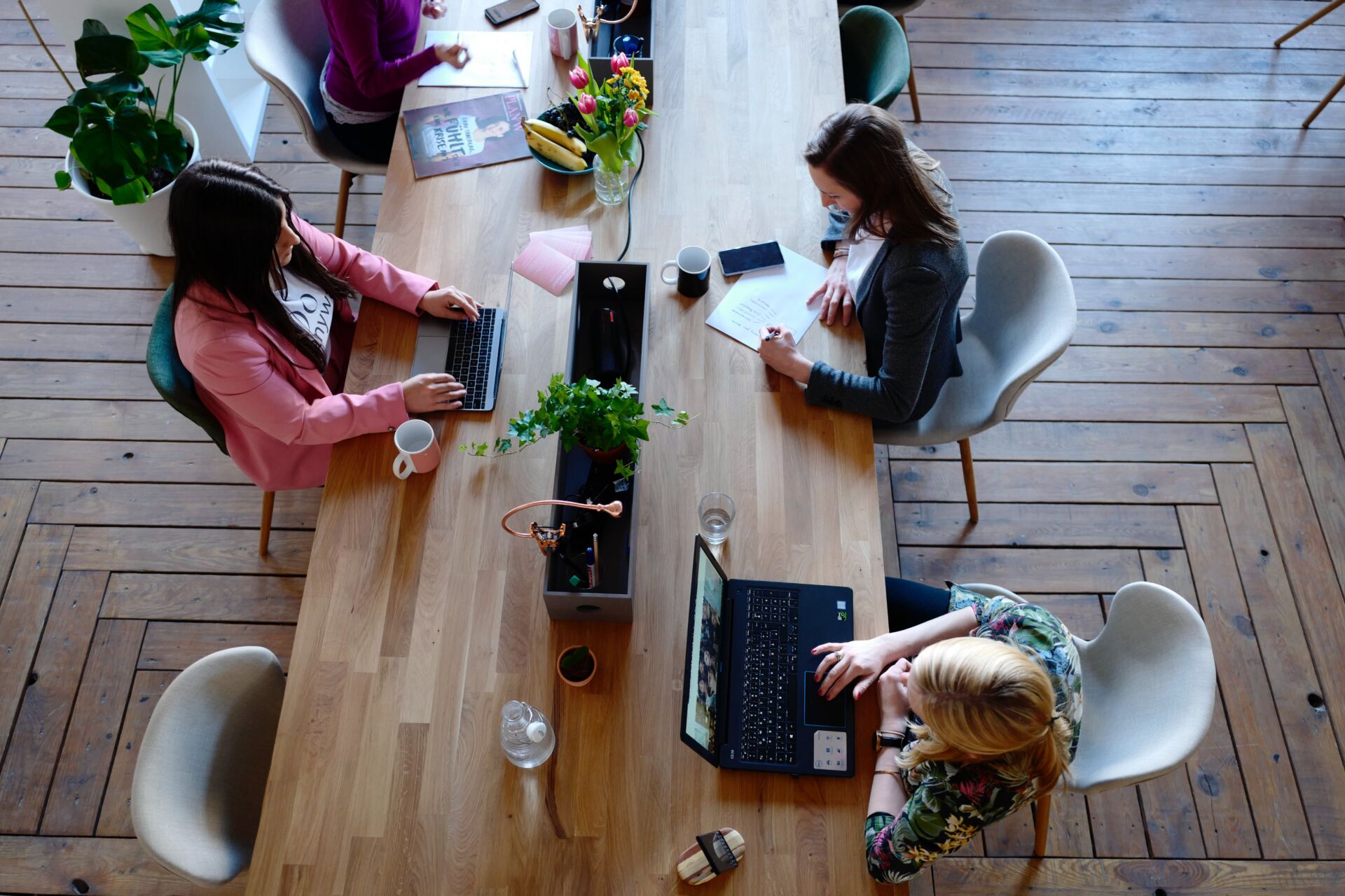 a long table with several people working