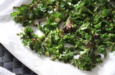 crispy kale chips on a baking sheet